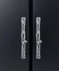 Rustic Branch Cabinet Handle Set Zinc Alloy Twig Pulls for drawers and closet doors on a black cabinet, decorative hardware