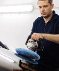 Person using 20 Piece Car Orbital Buffer Polisher Pad Bonnet Microfiber Cover For Seven To Eight Inch Pads on car hood