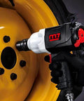 Rugged Real Deal One Inch Air Impact Wrench With Twin Hammer Clutch Unleashes 1300 Ft Lbs Reverse Torque used on black wheel bolts.