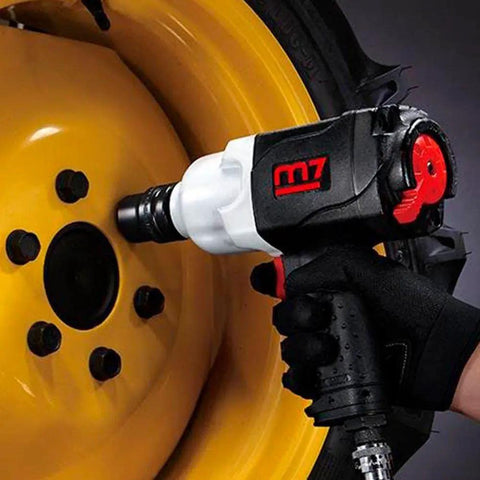 Rugged Real Deal One Inch Air Impact Wrench With Twin Hammer Clutch Unleashes 1300 Ft Lbs Reverse Torque used on black wheel bolts.