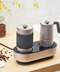 Mini Espresso Maker With Dual Pressure Extraction And Silky Milk Frother Styled Like A Classic Moka Pot on kitchen counter.