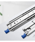 Close-up of Heavy Duty Drawer Slides With Lock, 120kg Load Capacity, featuring blue locking mechanism and stainless steel finish.