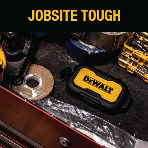 Heavy Duty Portable Charger Power Bank With IP67 Dust And Water Resistance, 10000 mAh Battery Pack shown on a workbench.