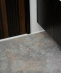 Self Adhesive Marble Look Peel And Stick Floor Tiles 12 By 12 Vinyl Sticker with a slip-resistant surface in a bathroom corner