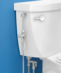Aquaus 360 All Brass Handheld Bidet Sprayer for Toilet with Ergonomic Dual Thumb Controls shown mounted on toilet.