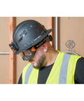 Construction worker wearing Clear Lens Safety Goggles With Anti Fog Scratch Resistant Eye Protection PPE UV Shield under hard hat