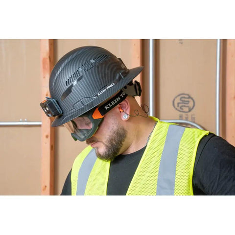 Construction worker wearing Clear Lens Safety Goggles With Anti Fog Scratch Resistant Eye Protection PPE UV Shield under hard hat