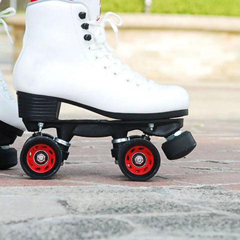 Close-up of quad skate with Two Pack Roller Skate Toe Stops Adjustable Rubber Brake Blocks Round Shape Replacement Parts For Quad Skates Indoor Outdoor Use, High Elastic Rubber For Safer, Smoother Braking And Easy Install attached.