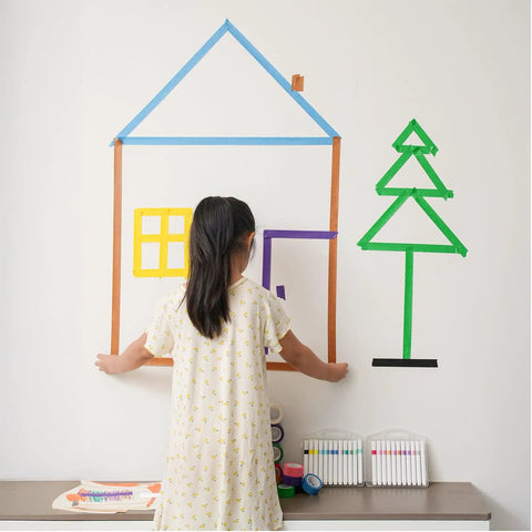 Child creating wall art with Rainbow Masking Tape Set With Twelve Rolls Of Colorful Painter Tape One Inch By Seven Hundred Twenty Feet Each