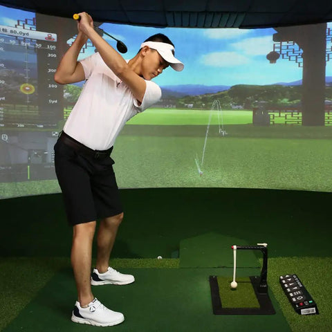 Man using Golf Swing Trainer Putting Mat With 360 Degree Ball Return in indoor simulation room.