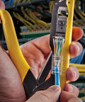 Pro Grade Data Cable Crimper And Pass Through CAT6 Modular Plug Kit in use, close-up on crimping tool with cables