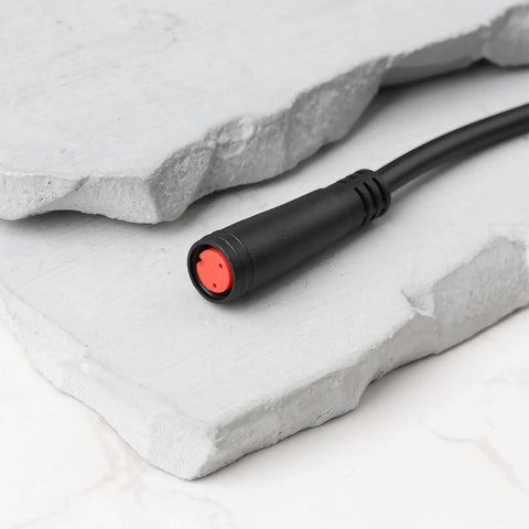 Close-up of 2 Pin E Bike Light Throttle Waterproof Extension Cable 56 Cm Long For 52V 48V 36V E Bike Motors IP65 with black insulation