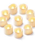 Beige flameless LED tea light candles in a cluster with flickering warm flames
