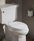 Toilet seat with color matched hinges and compression molded wood for traditional bathrooms, classic and durable.