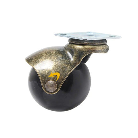 Four Pack Vintage Bronze Swivel Caster Wheels 2 Inch Replacement Furniture Casters Roll Smooth With Sturdy Brake Lock 360 Degree Rotating Chair Glides Easy Install For Sofas close-up view of vintage bronze swivel caster with black wheel.
