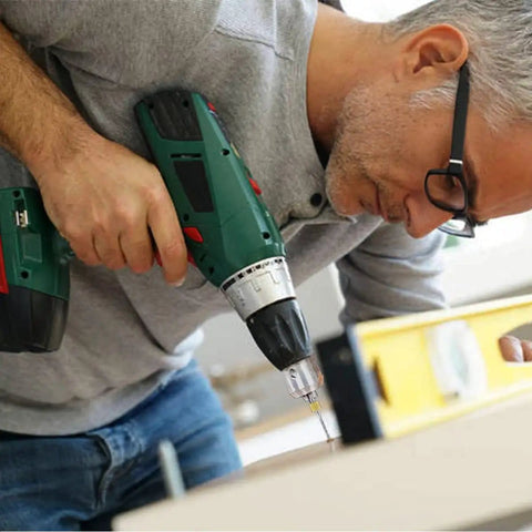 Man using a power drill with focus on the 30 Piece Tungsten Carbide Micro PCB Drill Bit Set With 0.3mm And 1.2mm Shanks For Precision PCB Drilling CNC Engraving And Rotary Tool Projects Ultra Tough Wear Resistant Tungsten Steel For Circuit Boards
