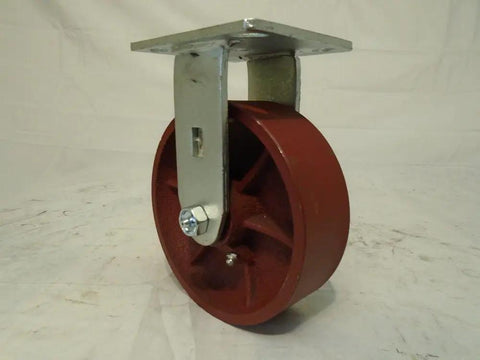 6 Inch Ductile Steel Caster Wheel Set With Heavy Duty Roller Bearings And Zerk Fitting featuring a red wheel and metal bracket for warehouse use.