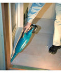 Person using Cordless 18V Li Ion Vacuum Cleaner Body Only for Vehicles and Jobsites, Lightweight with Strong Suction and Large Dust Capacity