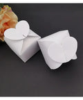 Colorful Love Heart Candy Gift Box Set Of 50, Perfect For Wedding Favors, sturdy cardboard, flat foldable design shown closed with flower