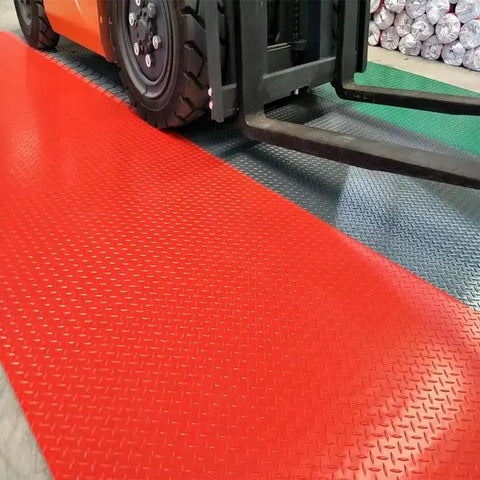 Heavy Duty Insulating Rubber Electrical Safety Mat Built Like A Tank For Real Deal High Voltage Protection And Slip Resistant Flooring That Keeps Every Tradesman Locked In All Day showing red mat under forklift wheels.