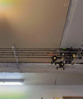8 Rod Ceiling Rack For Fishing Poles Aluminum Alloy Holder Organizer For Garage Cabin Basement Overhead Storage And Quick Access Built Tough For Easy Grab installed on ceiling with fishing rods.