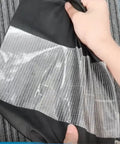 Heavy Duty Waterproof Repair Tape Kit For RV Awnings Tents Tarps Boat Covers Sail Fabric And More being applied to fabric
