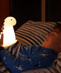 Child holding Multicolor LED Silicone Night Light Brontosaurus Tap Light For Kids Nursery Decor Rechargeable Cozy Sleep Glow