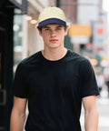 Breathable Unisex Trucker Hat With Adjustable Buckle For All Day Outdoor Fun And Water Adventures, worn by model walking in city