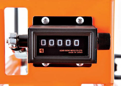 Close-up of Easy Read Mechanical Counter on Heavy Duty Metal Frame Measuring Wheel With Dual Scale Hub for Construction Sites.