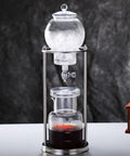 Premium Cold Brew Drip Tower With Adjustable Flow Control Borosilicate Glass Carafe And Heavy Duty Stainless Steel 600Ml showing iced coffee brewing.