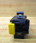 Front view of Manifold P-027050-00001 replacement for Bosch Rexroth systems with valve-mounting ports on wooden background