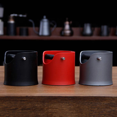 Zero Stress Espresso Knock Box With Shock Absorbent Deep Bowl For Quick Coffee Grounds Cleanup And Solid Tamping Station Setup, available in black, red, and gray.