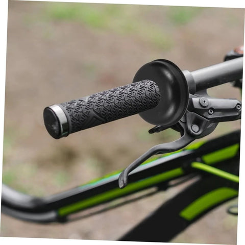 Close-up of a mountain bike handlebar with black grip and brake lever, focus on handle and lever setup, no washers visible.