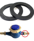 Two black rubber gaskets and a blue water meter with brass threaded fittings