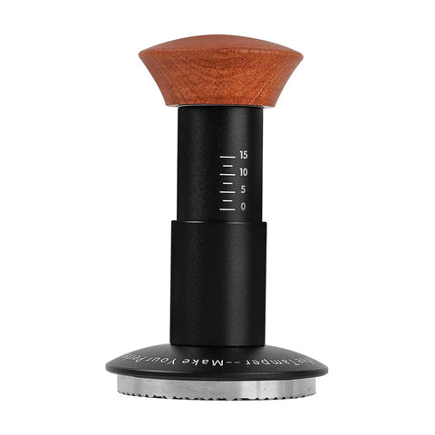 Heavy Hitter Spring Loaded Coffee Tamper With Precision Distribution Leveler And Clear Pressure Scale For Flawless Espresso Pucks on a white background, featuring a hardwood handle and measuring scale.