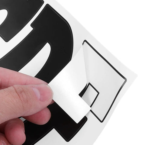 Six Sheets Black 4 Inch Outdoor Alphabet Decals Self Adhesive PVC Vinyl Letters For Signs Mailboxes And Dorm Doors Easy Peel And Stick Weatherproof Durable Outdoor Lettering Residue Free Repositioning DIY Ready, hand peeling a black vinyl number