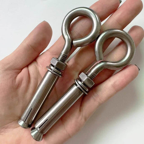 2 Pack M8 Stainless Steel Expansion Eyebolts Heavy Duty Beefy Shoulder Lag Ring Bolts Lifting Hardware With Nut For Wall Ceiling Concrete Masonry Anchors Rustproof Durable Construction Built To Last For Heavy Lifts in hand.