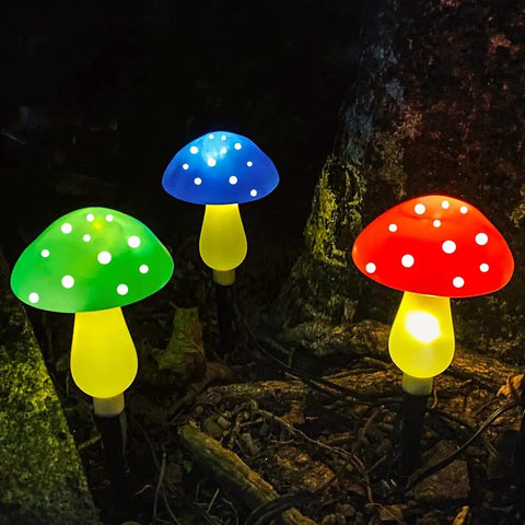 Colorful Upgraded Dope Solar Mushroom Lights for outdoors, glowing green, blue, and red with eight modes, in garden decor.