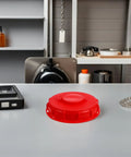 Two Peas Abs Ibc Container Lids With Vent Holes Offer Red Tote Covers For Tanks Perfect For Chemical Food Or Pharma Storage Needs Safe Breathable Design Prevents Pressure Buildup Inside Your Big Plastic Tanks Today on a countertop.