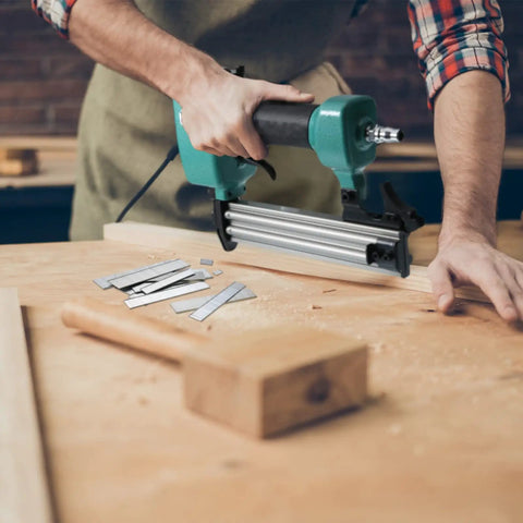 Craftsperson using nailer with 18 Gauge Brad Nails Set With Galvanized Finish Pro Grade 2000 Pieces in workshop