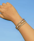 Premium Gold Boho Leather Wrap Bracelet Featuring Chunky Crystal Beads And Sparkling Rhinestone Layers With Strong Magnetic Clasp on wrist.