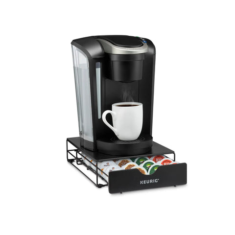 Slim Under-Counter Coffee Pod Drawer For 24 K-Cups, metal drawer under Keurig with steaming mug, organized pod storage visible