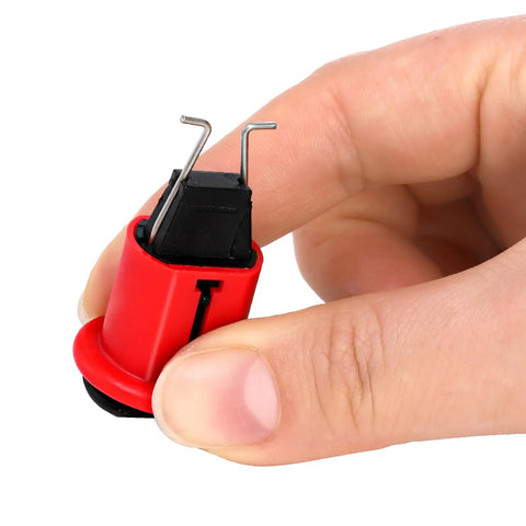 Hand holding a 12 Pack Pin Out Standard Circuit Breaker Lockout Device for Electrical Safety, industrial grade, red nylon construction.