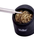 Soldering Brass Sponge Tip Cleaner With Silicone Holder, iron tip in coil, pro-grade maintenance tool on desktop, reduces residue