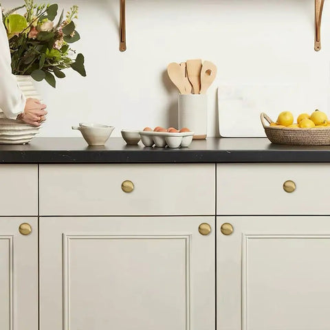One And One Quarter Inch Champagne Bronze Zinc Alloy Cabinet Knob Single Hole Center Mount on kitchen drawers
