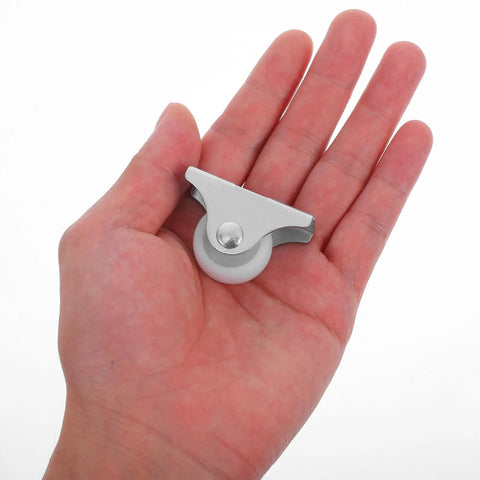 Four Piece Fixed Caster Wheels For Furniture And Cabinets, Durable Non Swivel Polypropylene Roller held in hand.