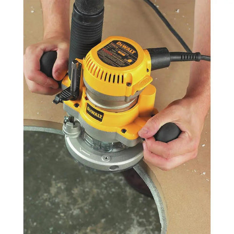 Beefy 2 1/4 Hp Plunge Router Kit with sturdy fixed base used for precise contour routing on hardwood surface.