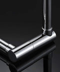 Close-up of Deck Mount Pot Filler Faucet in Chrome Finish with Extension Shank and 20 Inch Dual Swing Joints Spout on black surface.