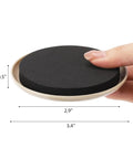 Close-up of 20 Pack Carpet Furniture Sliders 3.5 Inch Round Moving Pads with black EVA foam and beige plastic base held by a hand