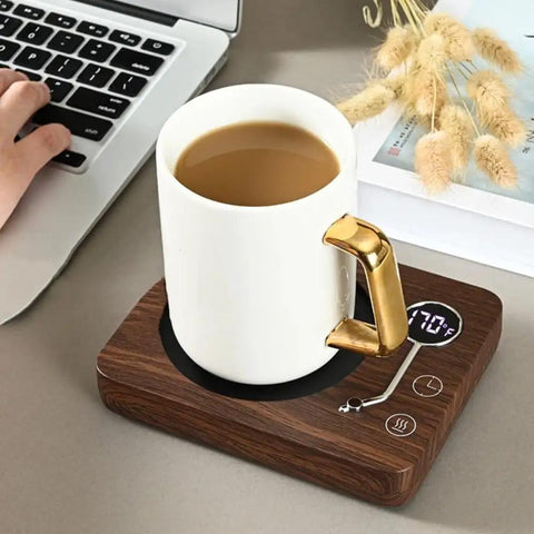 Electric Coffee Mug Warmer With Three Heat Settings And Four Hour Auto Shutoff Keeps Your Favorite Brew Piping Hot For Lazy Desk Setup Or Cozy Kitchen Counters No More Cold Sip Vibes On The Daily, showing a white mug on a wooden warmer.